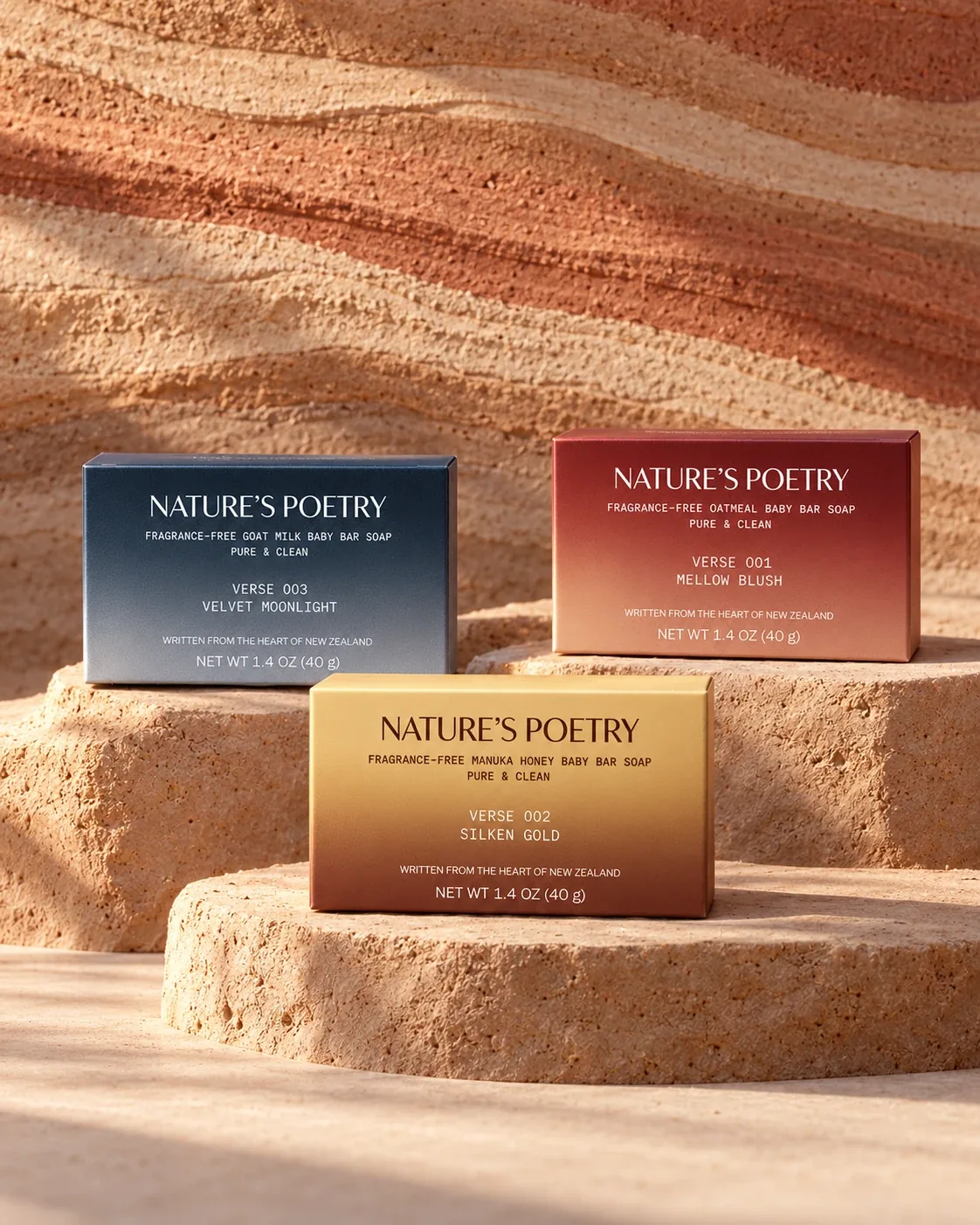 The three 1.4 oz (40 g) verse boxes on sandstone: Velvet Moonlight, Mellow Blush and Silken Gold.